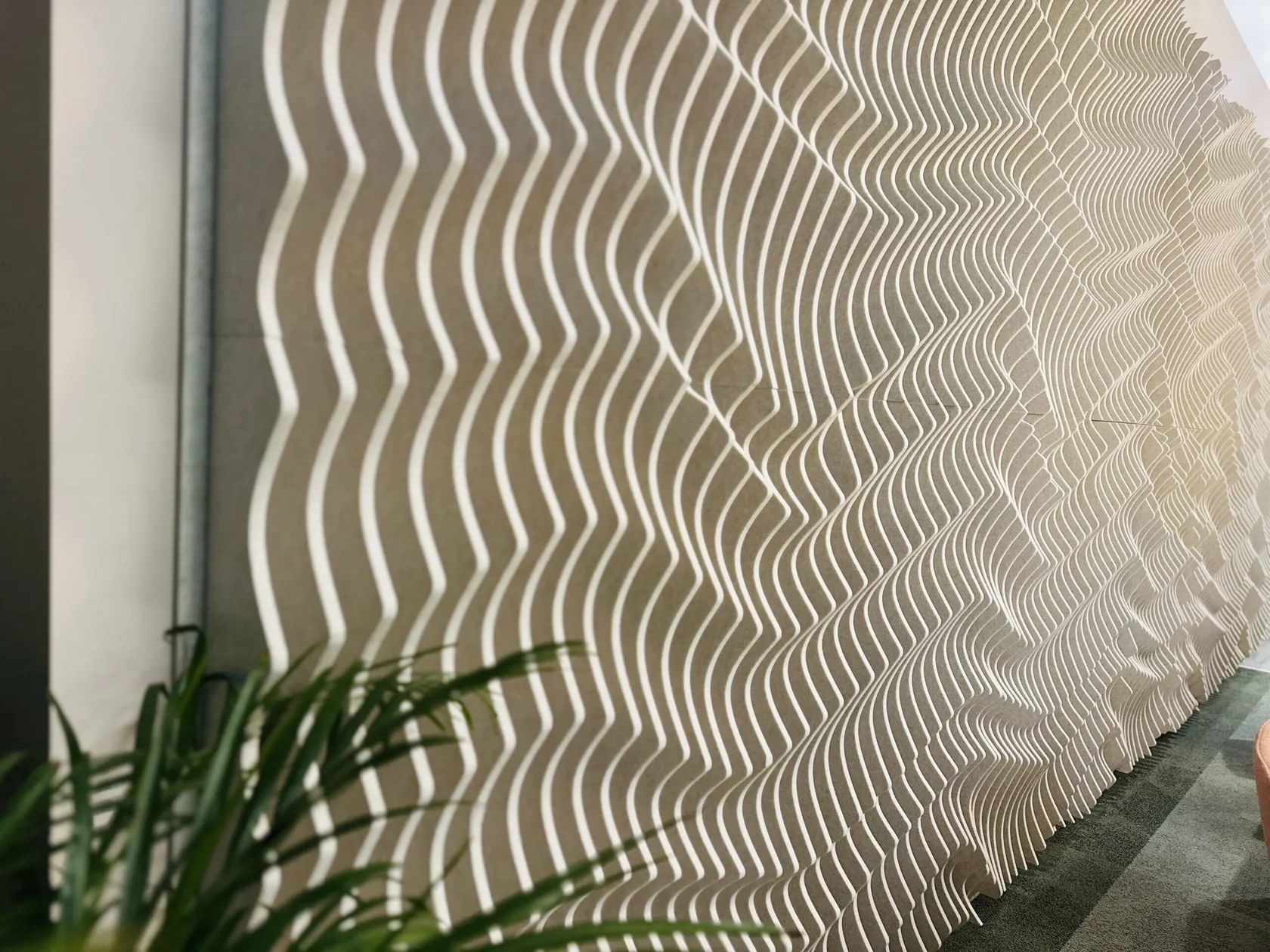 Modern lounge featuring architectural acoustic wood wall panels