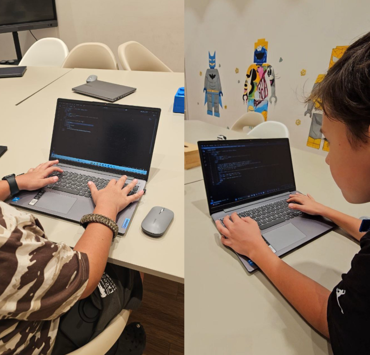 Students learning web design and coding on laptops