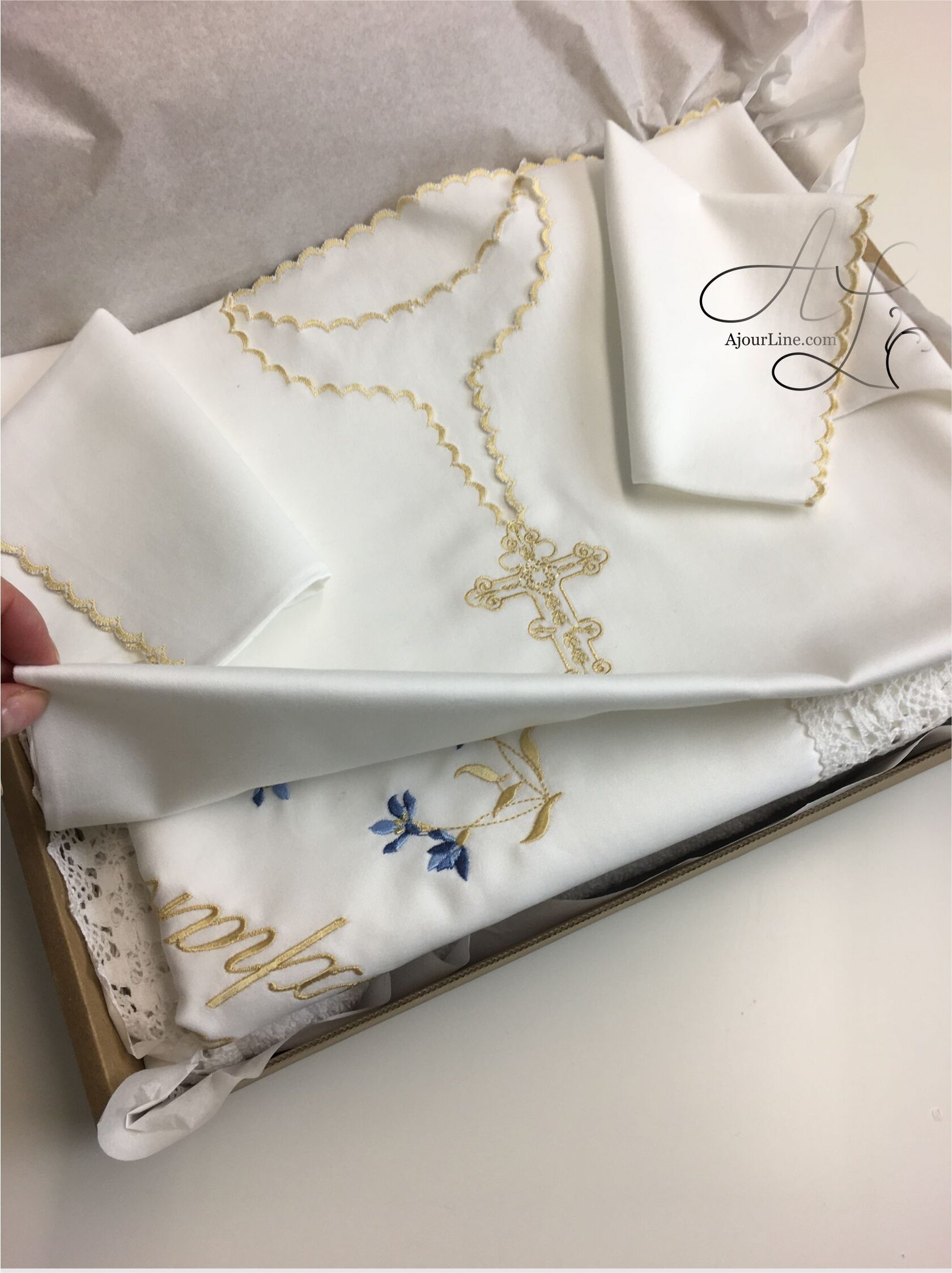 Christening set made from soft natural fabric, including a christening shirt and a hair lock pouch with embroidery, made to order in Riga, worldwide shipping.