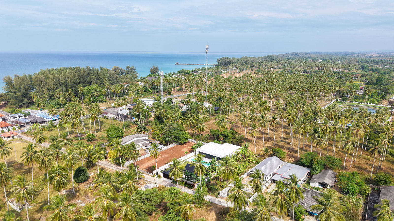 Aerial view toward Natai pier from the inland pool villa