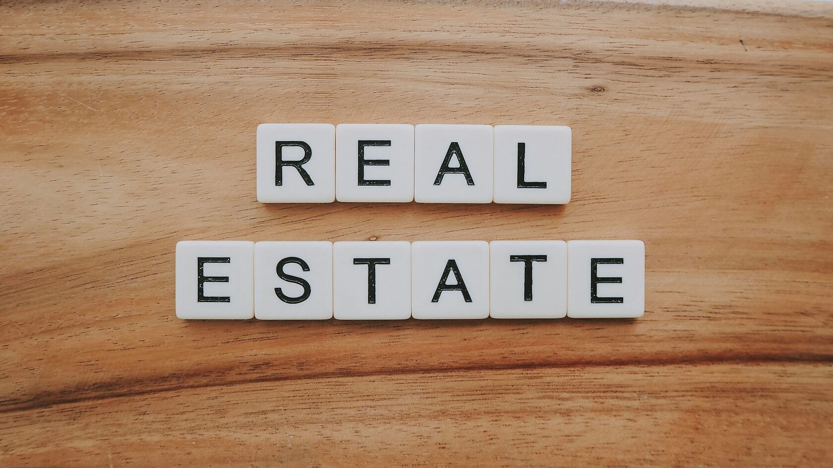 Real estate agent consulting clients in a modern home