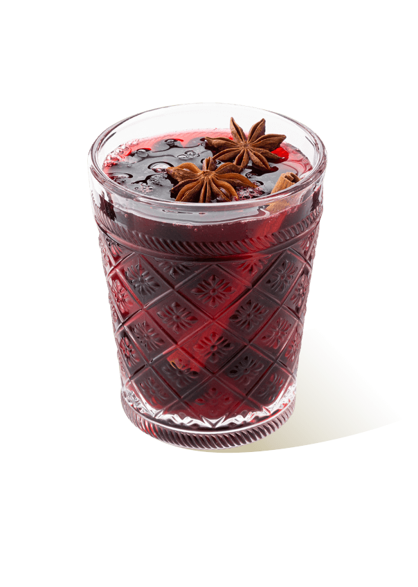 Glass filled with berry jam and star anise, representing The Base Beverage jam product for desserts and drinks