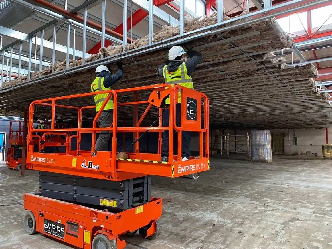 The Evolution MD LTD team installing a ceiling from an access platform