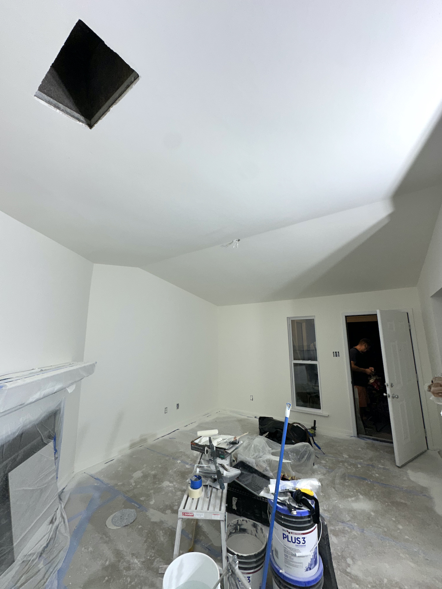 Living room during final ceiling and wall painting