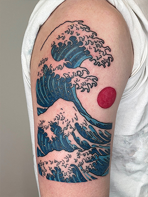 Japanese wave and red sun tattoo