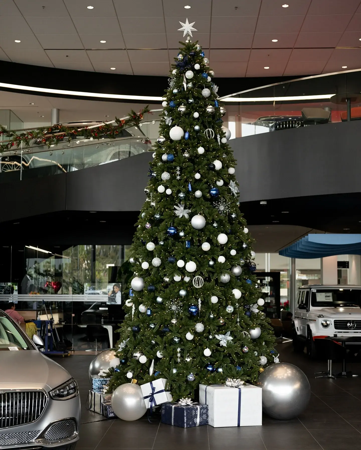 The full-height holiday tree on the two-story Mercedes-Benz of Escondido showroom floor