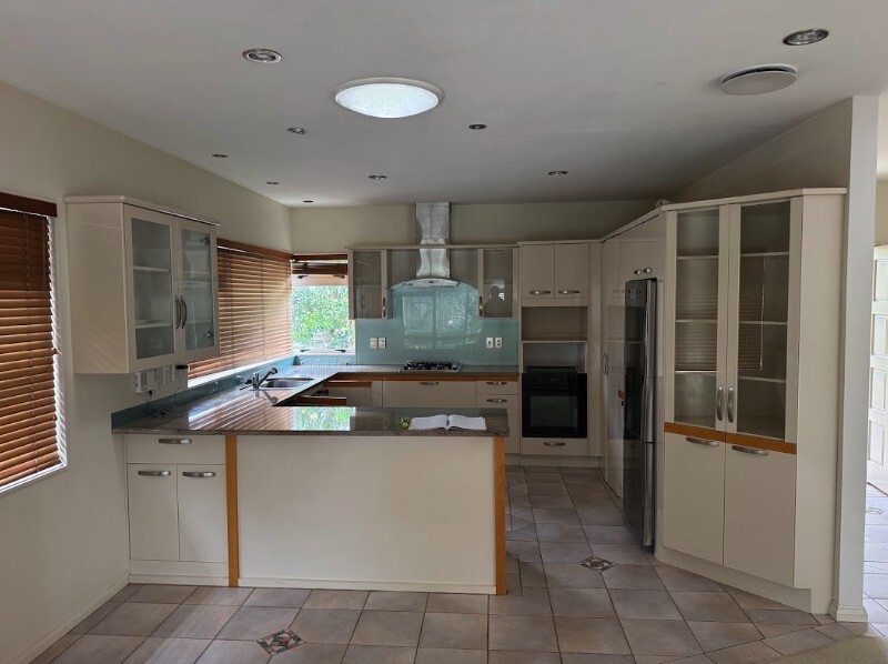 St Heliers kitchen before renovation, with older cabinetry and dark benchtops