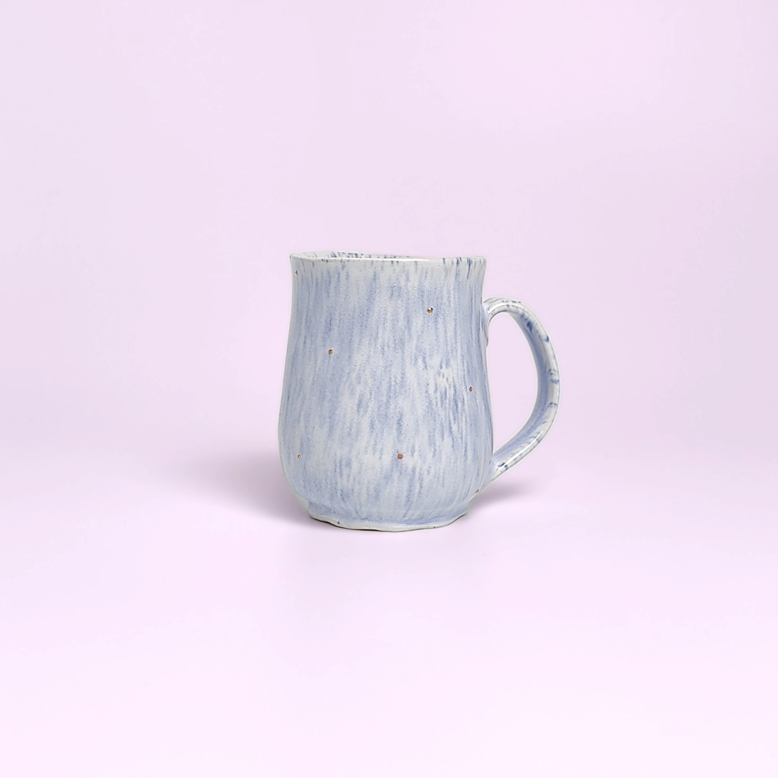 Artistic handmade ceramic cup and saucer in soft blue glaze with a girl medallion — a unique one-of-a-kind piece