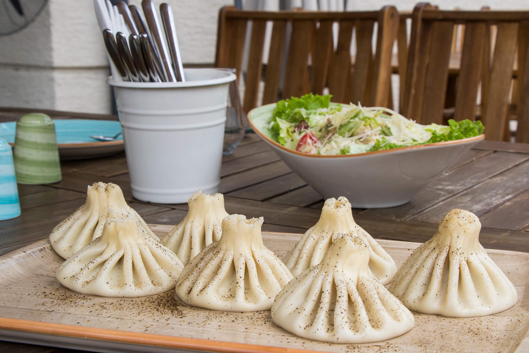 Traditional Georgian khinkali served hot with freshly ground black pepper