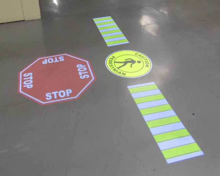 Maintenance inspection of an industrial projected floor sign