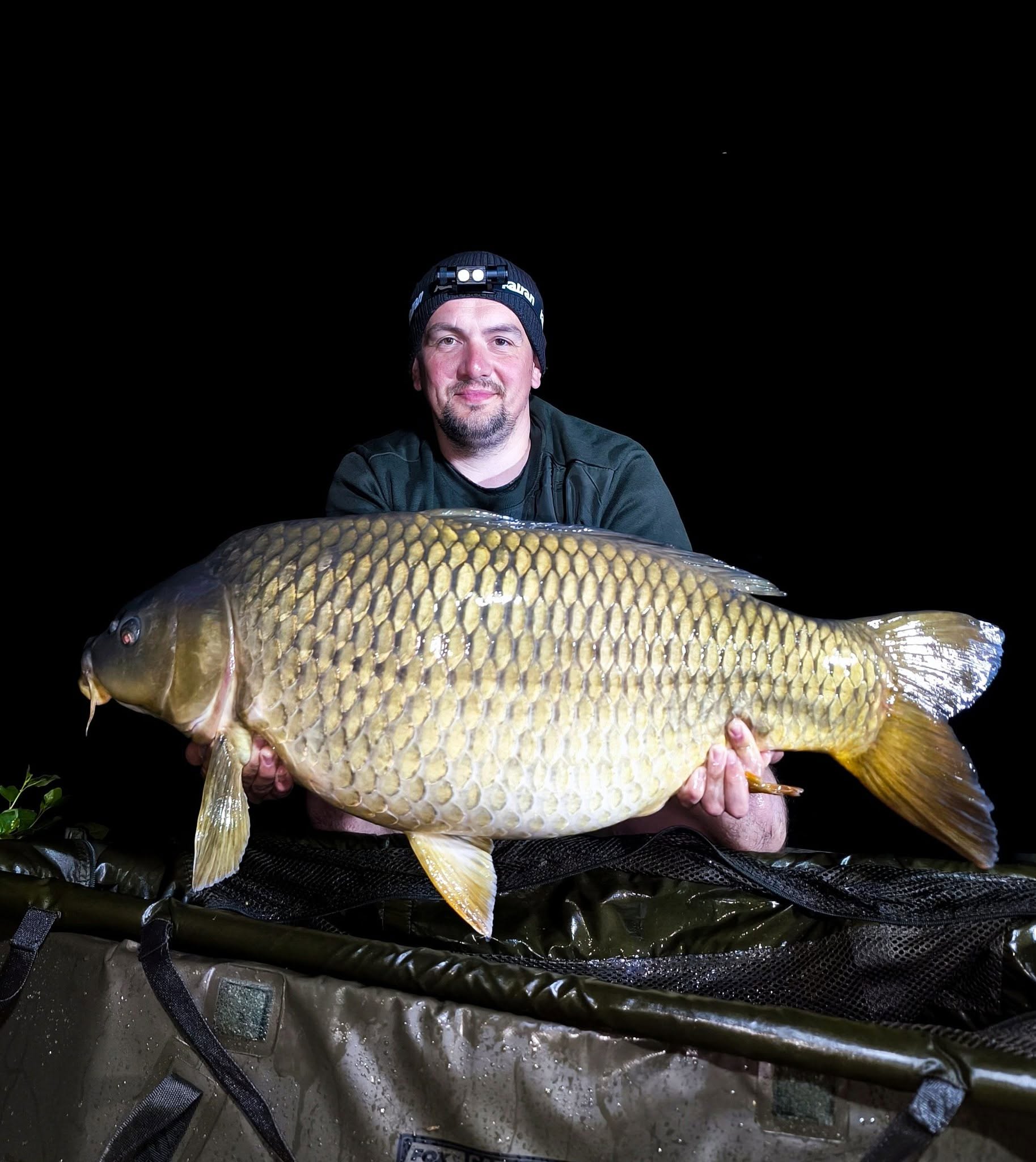 Angler using the Katran W/B 460 PRO headlamp