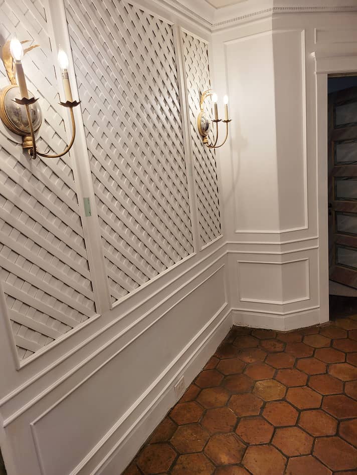 Lattice wall paneling wainscot in hall way 