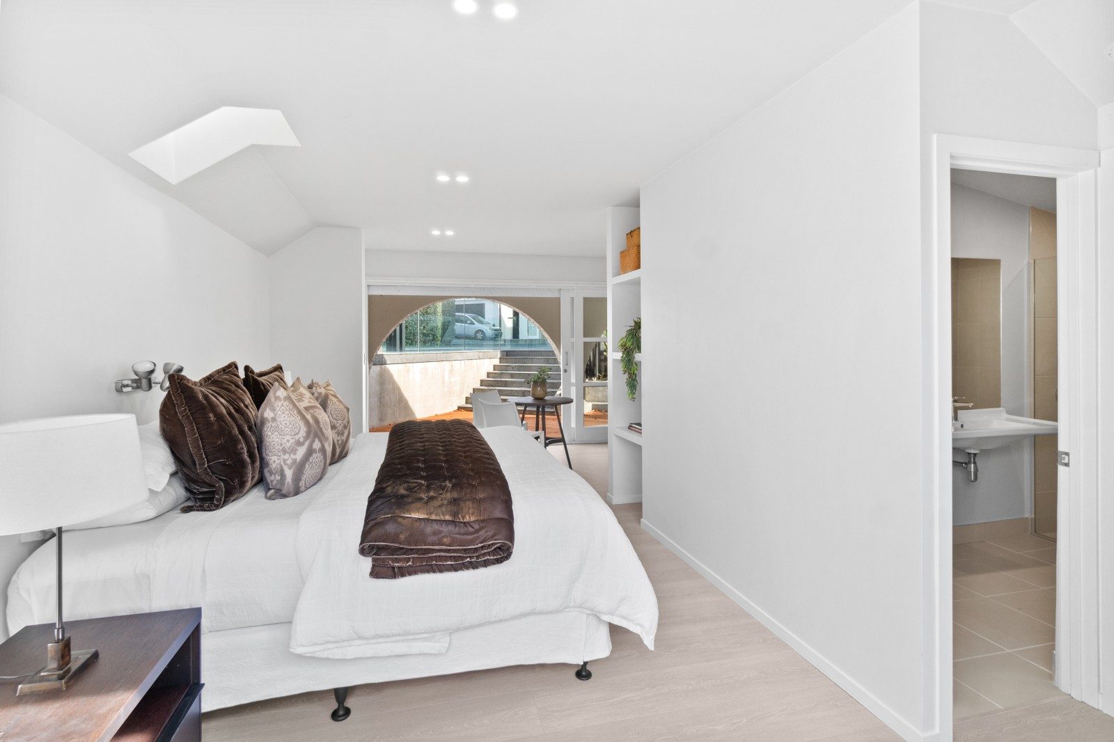 Bright Owens Road bedroom with neutral carpet and garden-facing glazing