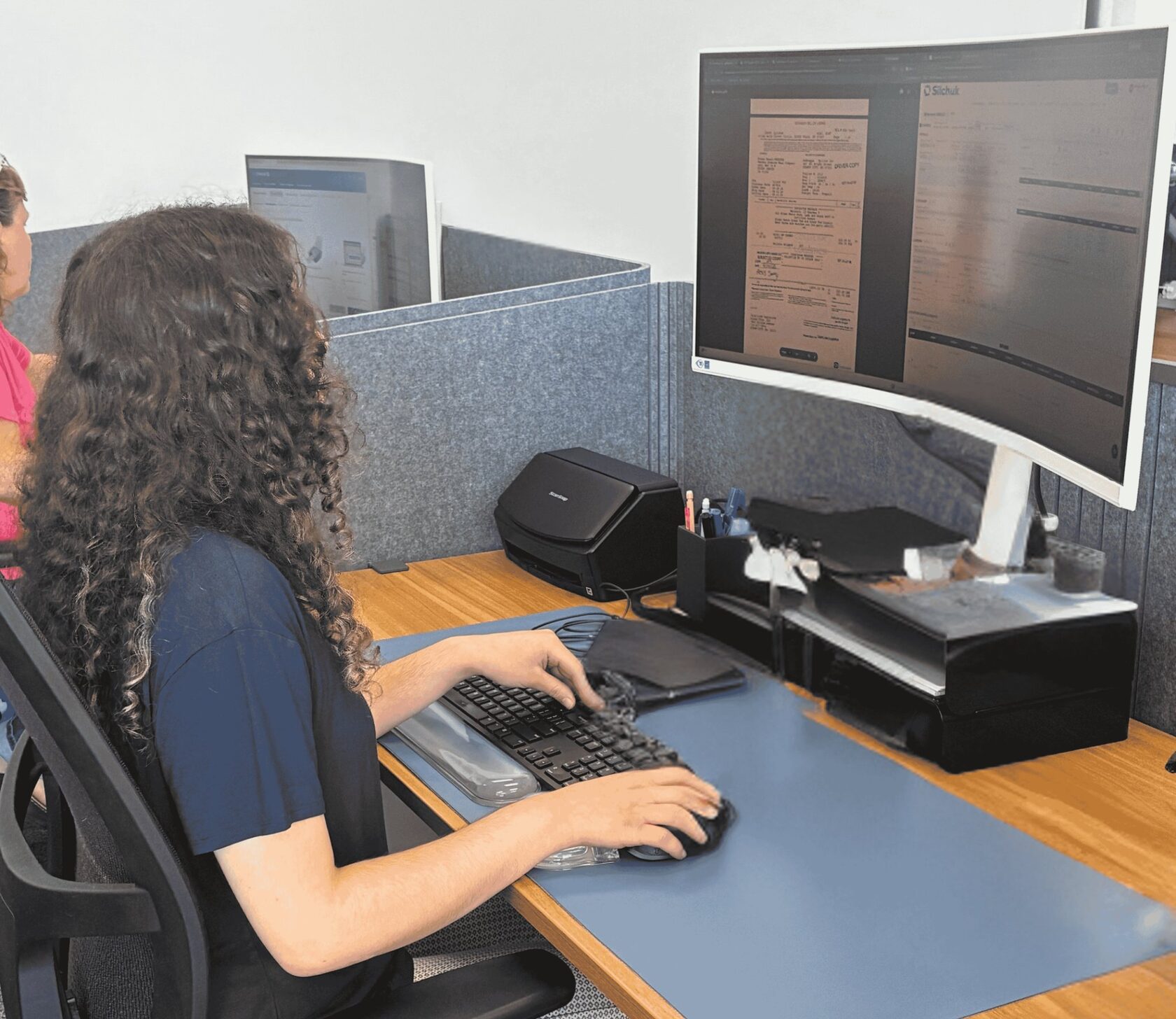 Experienced freight agent working at a desk