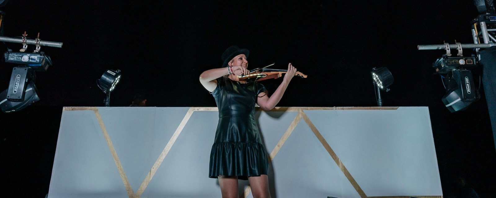 Polina performing an energetic midnight violin show during a wedding party