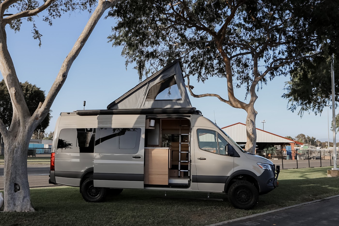 Tiny Planet van with the pop-up roof raised