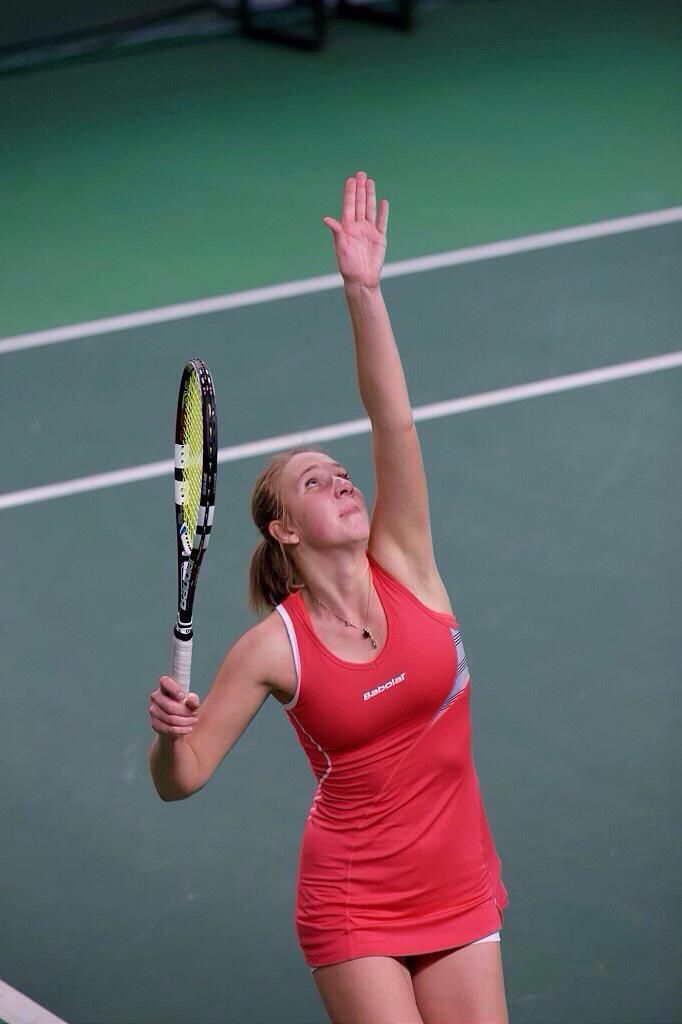 Player executing a serve in slow motion
