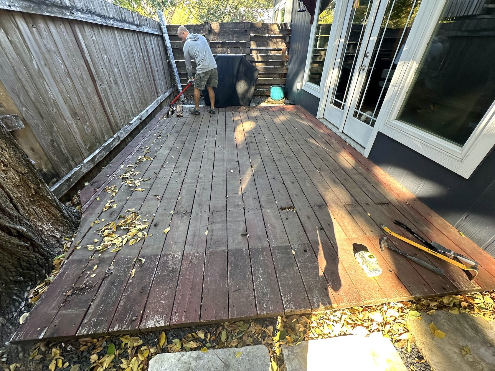 Deck before resurfacing — worn wood boards