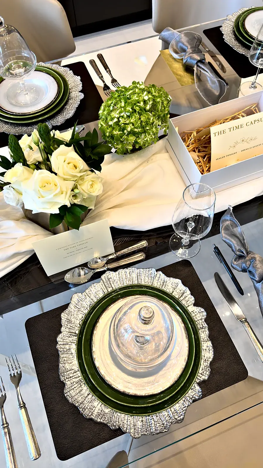 The box waits open at the center of the table — a time capsule birthday dinner at home by private chef Marina Staver in Miami