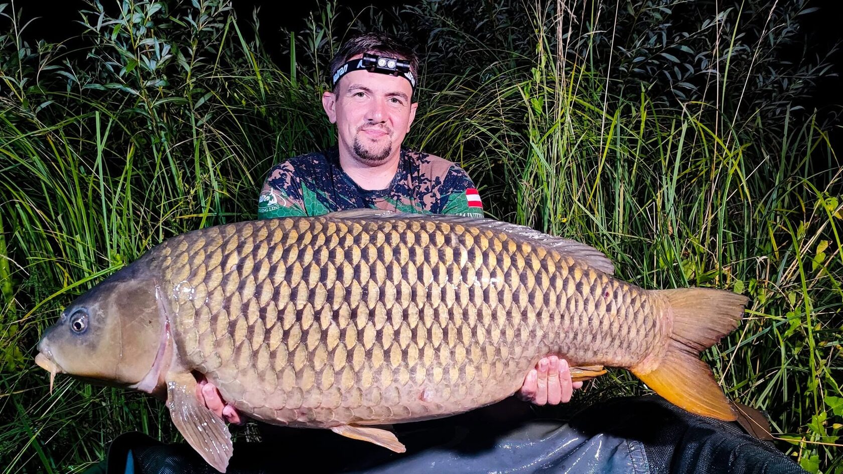 Angler using the Katran W/B 460 PRO headlamp