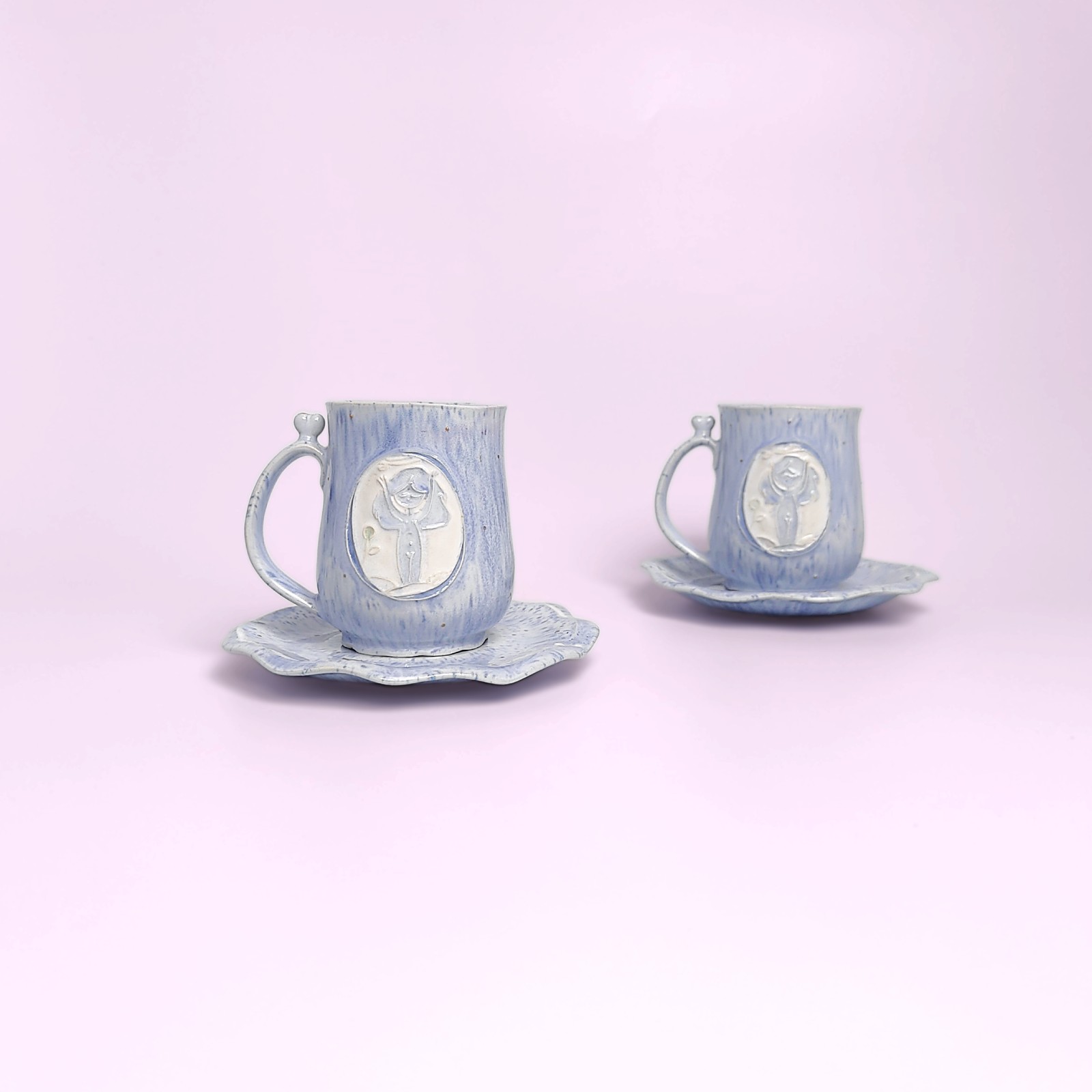 whimsical handmade ceramic tea set in soft blue glaze with forest fairy medallions — an elegant, one-of-a-kind creation
