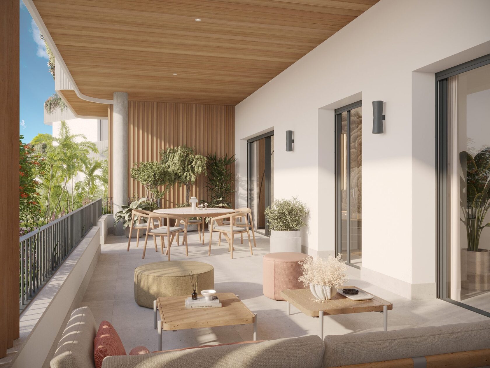 Covered terrace with dining table and planting