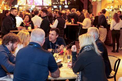 Participants at a forum social gathering