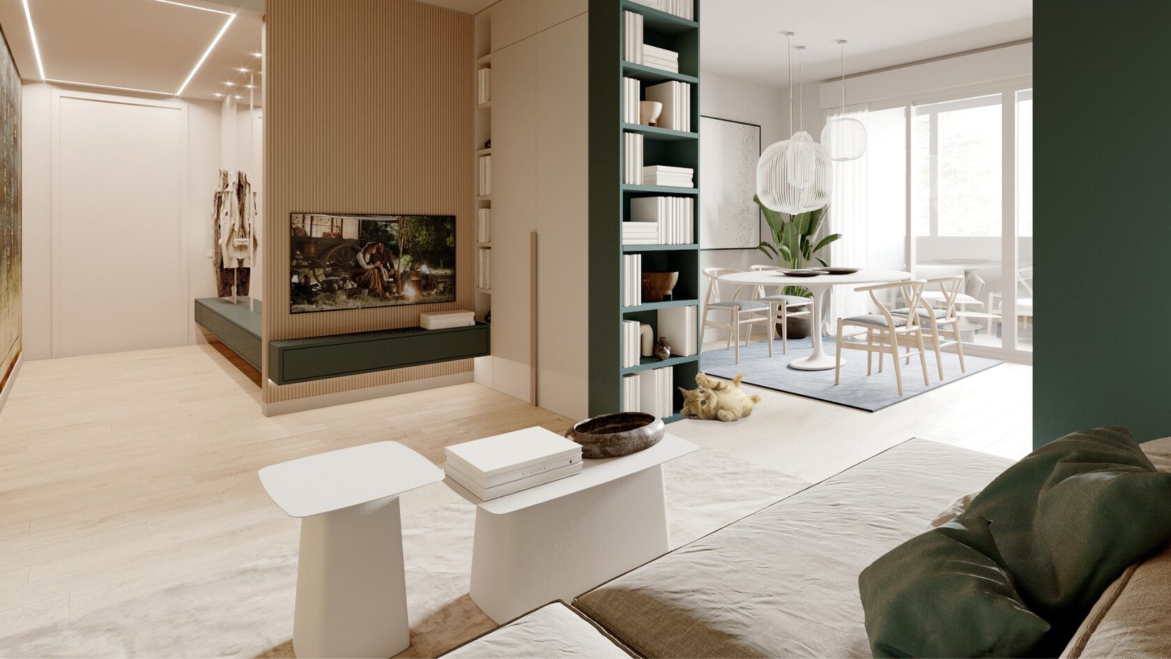 Casa Mikela: la zona giorno con la libreria verde a tutta altezza che apre sulla zona pranzo.