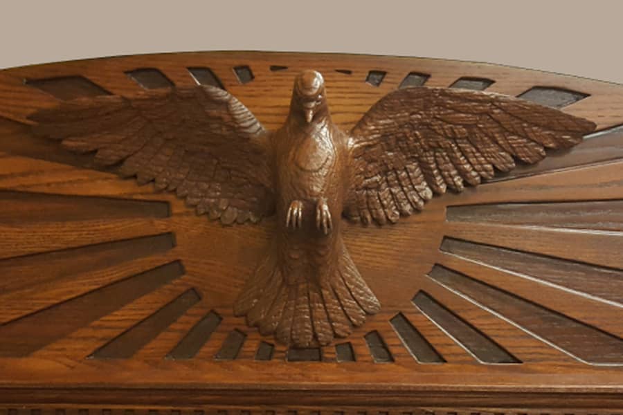 Detail of pediment on display cabinet - hand carved dove
