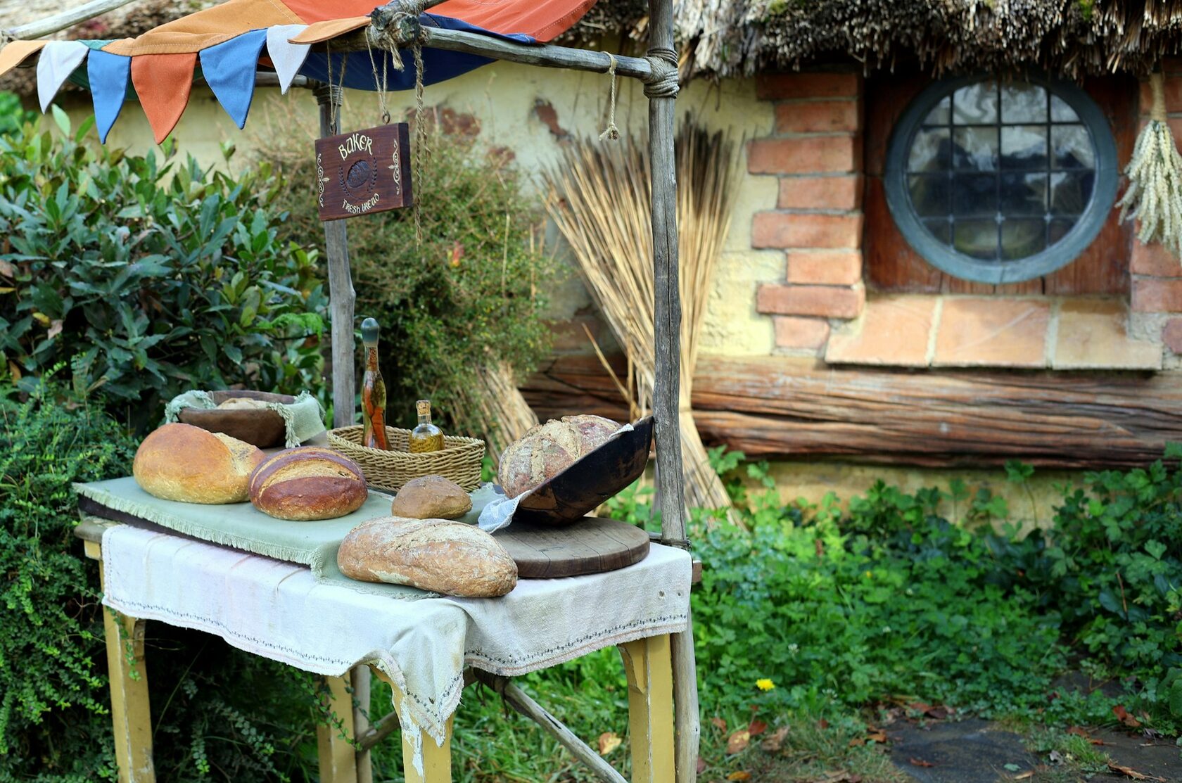 A steaming bowl of creamy seafood chowder with thick slices of Irish brown bread and butter on a rustic wooden table.