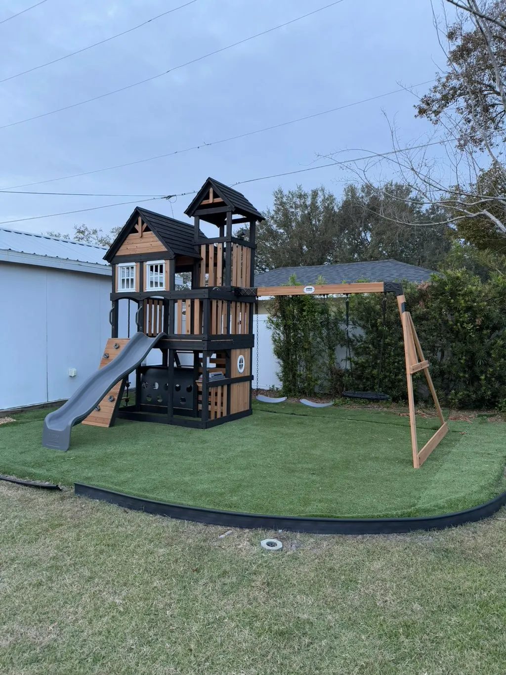 Backyard play equipment installation with swing set and artificial turf, Golden Beach FL