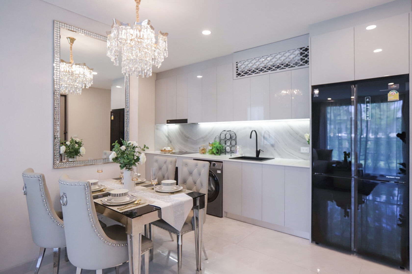 Kitchen with built-in appliances in the Copacabana Coral Reef show unit