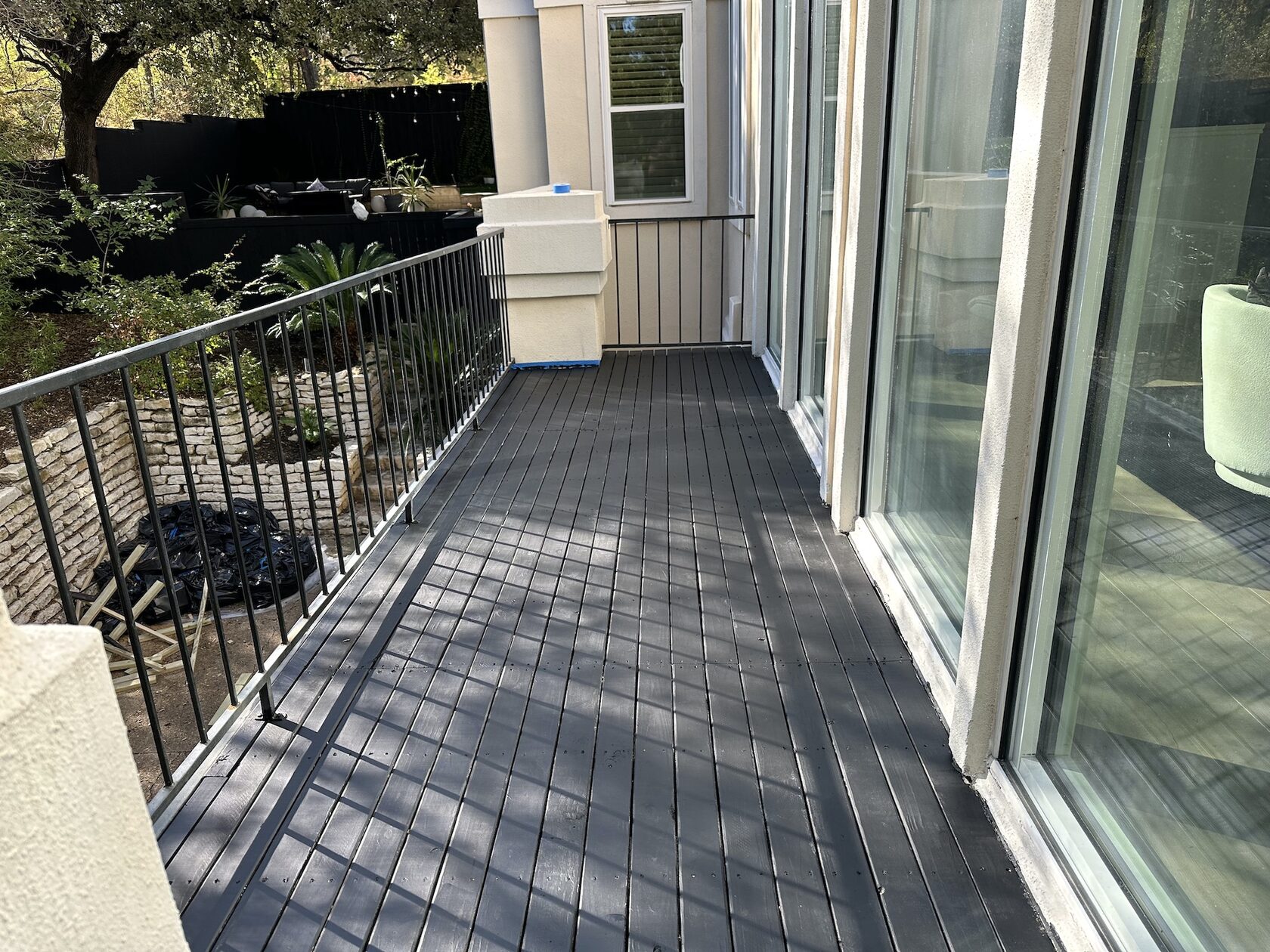 Porch repair Austin TX — wood board replacement and railing restoration