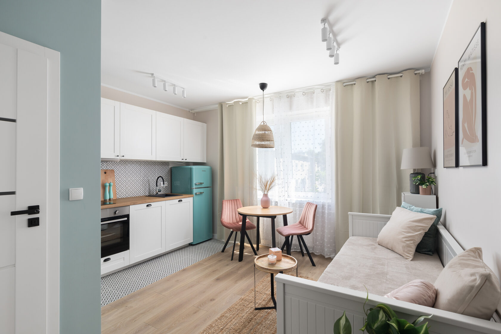 small apartment with a kitchen and dining area.