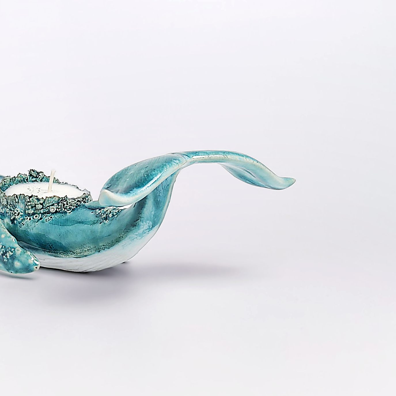 unique handmade green ceramic whale with ocean-glaze finish and detailed sculptural texture, featuring a candle inside