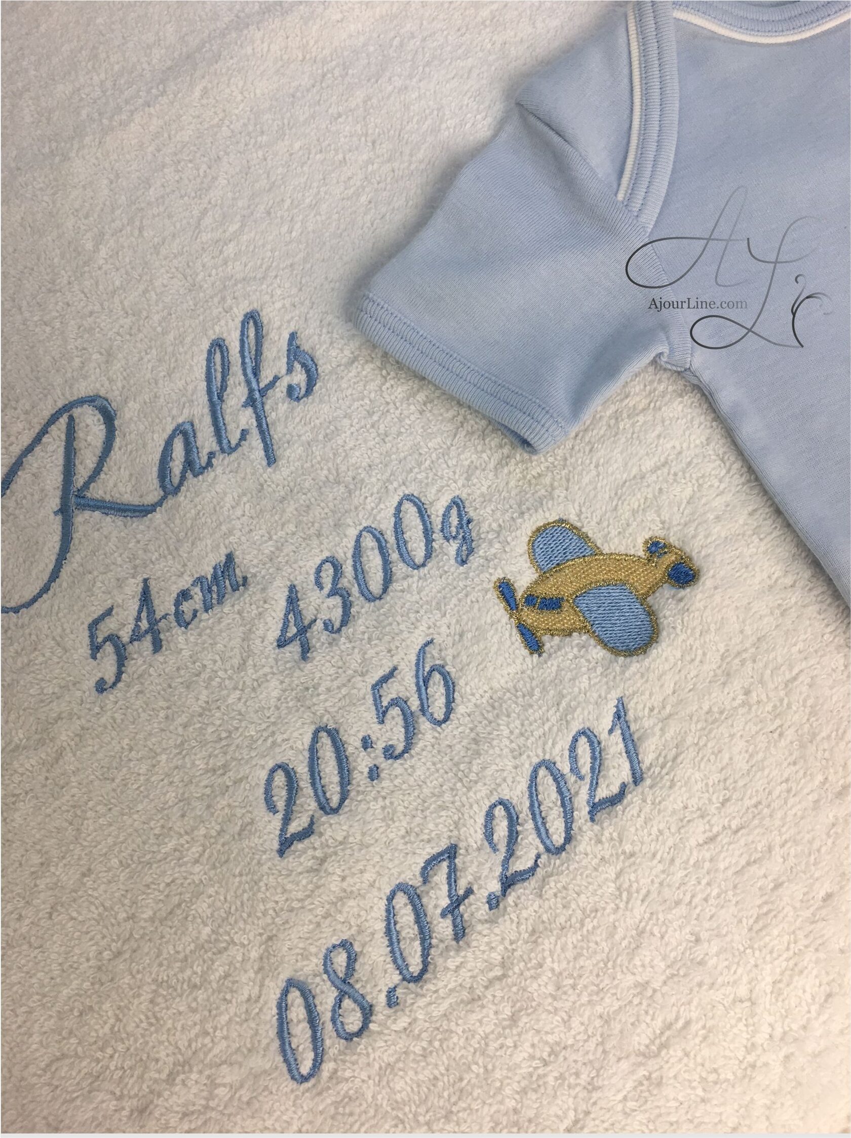personalized newborn towel with birth stats embroidery a thoughtful and unique gift for babies and new parents. Handmade in Riga, Latvia. Worldwide shipping available.