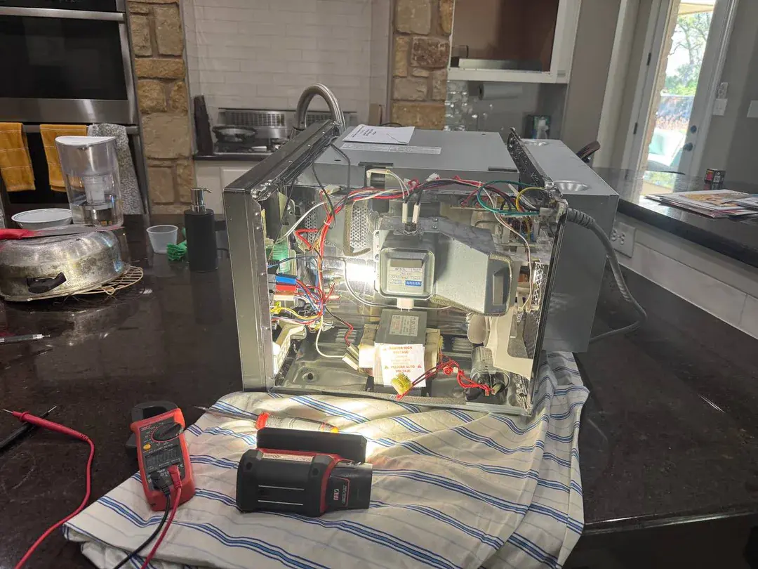 Appliance repair in progress