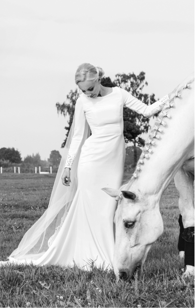 Bride in a wedding dress with a horse