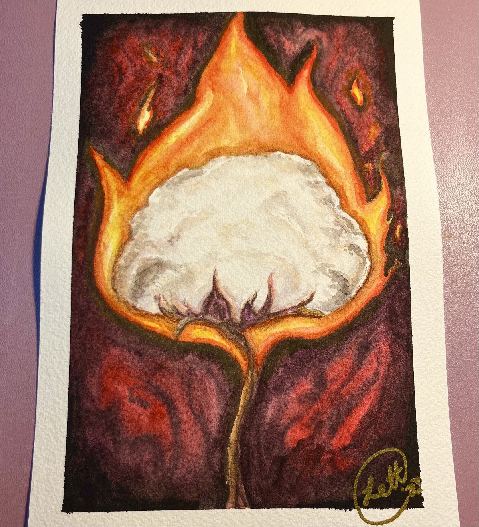 Ancestors’ Torch: a white cotton boll engulfed in orange flame against dark red and black.