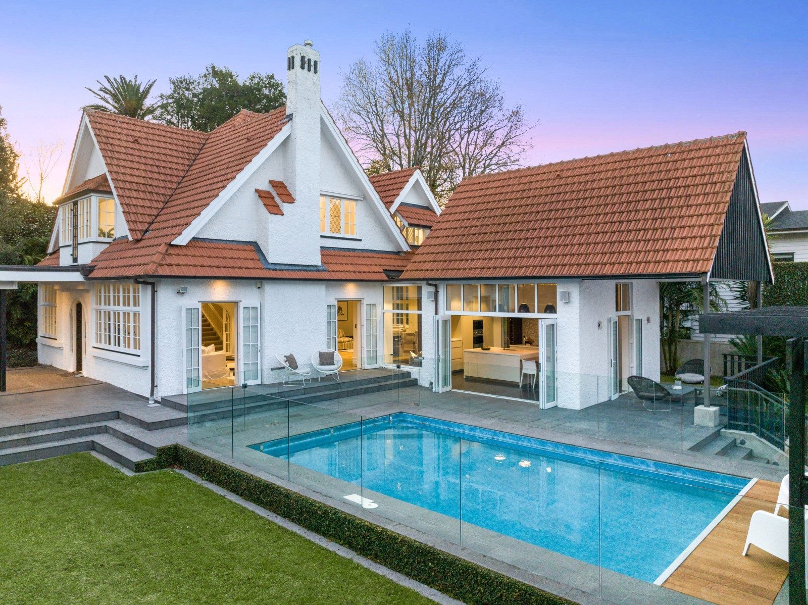 Owens Road Epsom character home, landscaped garden and swimming pool at dusk