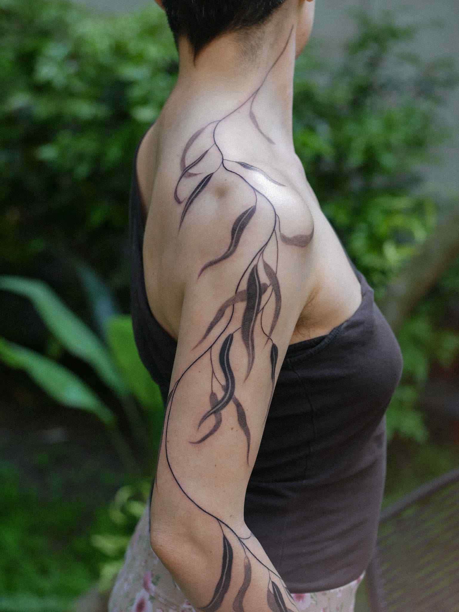 Flowing black lines along the arm