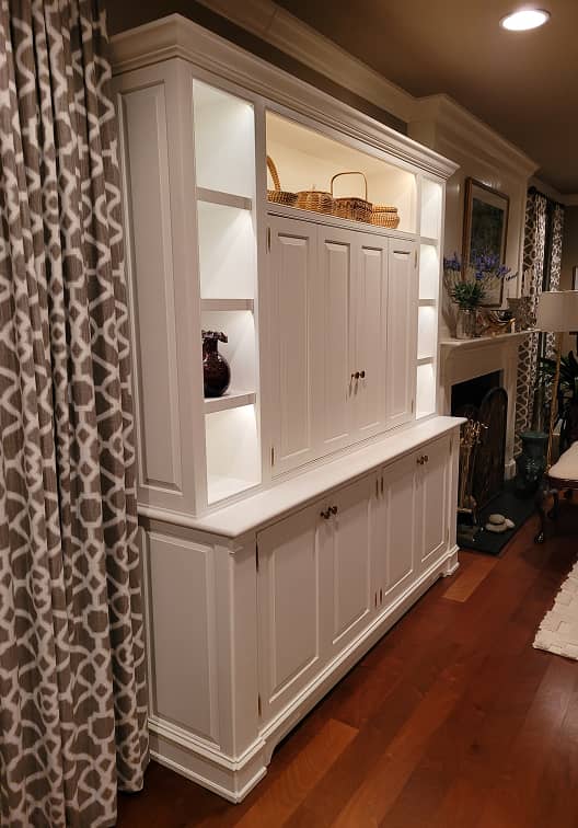 White color classic entertainment and display cabinet with concealed TV and lighted shelves