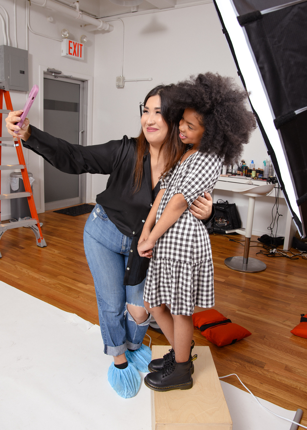 Child model with natural soft makeup preparation for camera