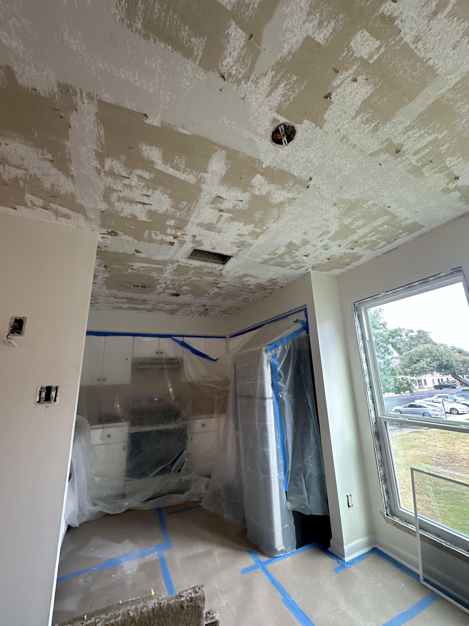 Vaulted ceiling during surface repair and skim-coat preparation