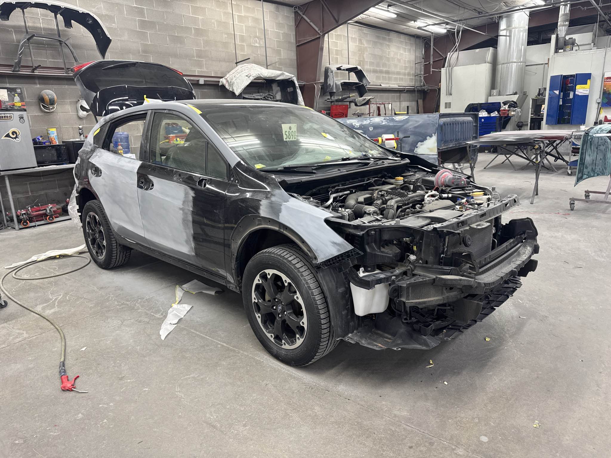 Vehicle being prepared for professional refinishing