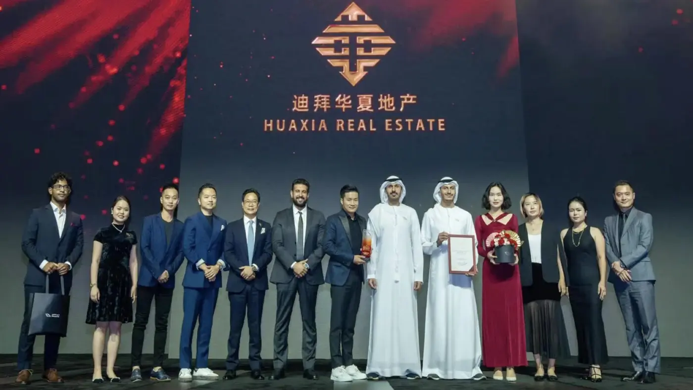 Huaxia Real Estate team receiving a Dubai developer award