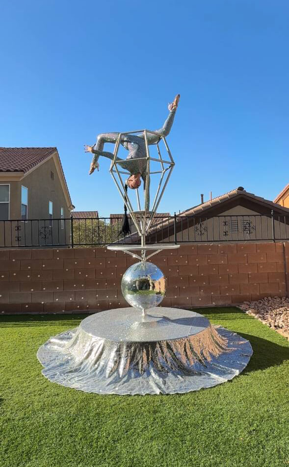 Contortion performance in a diamond prop on the Disco Luxe Platform — daylight