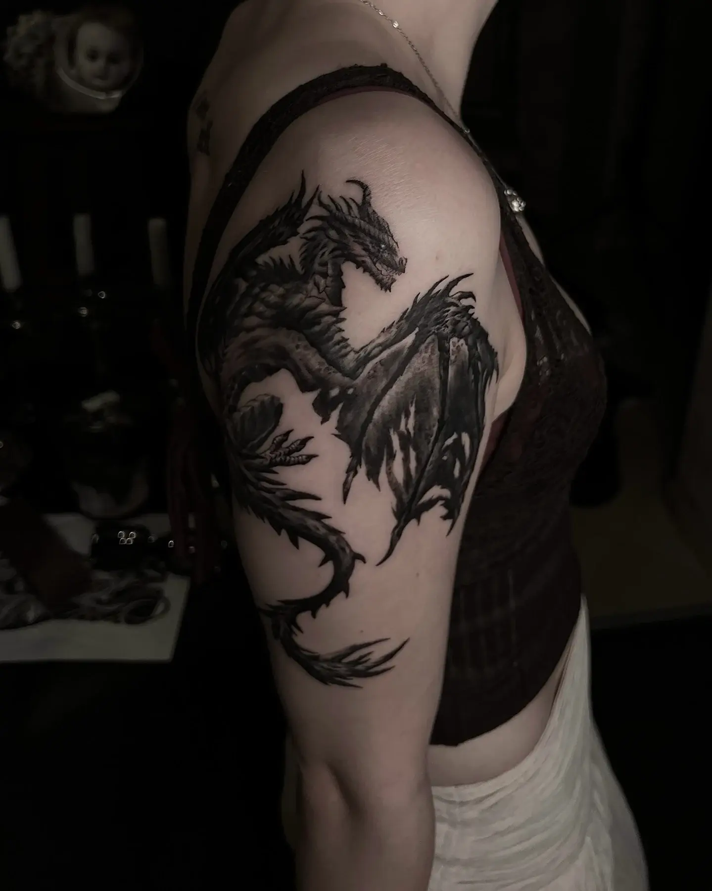 Dragon design on the upper arm — Lara