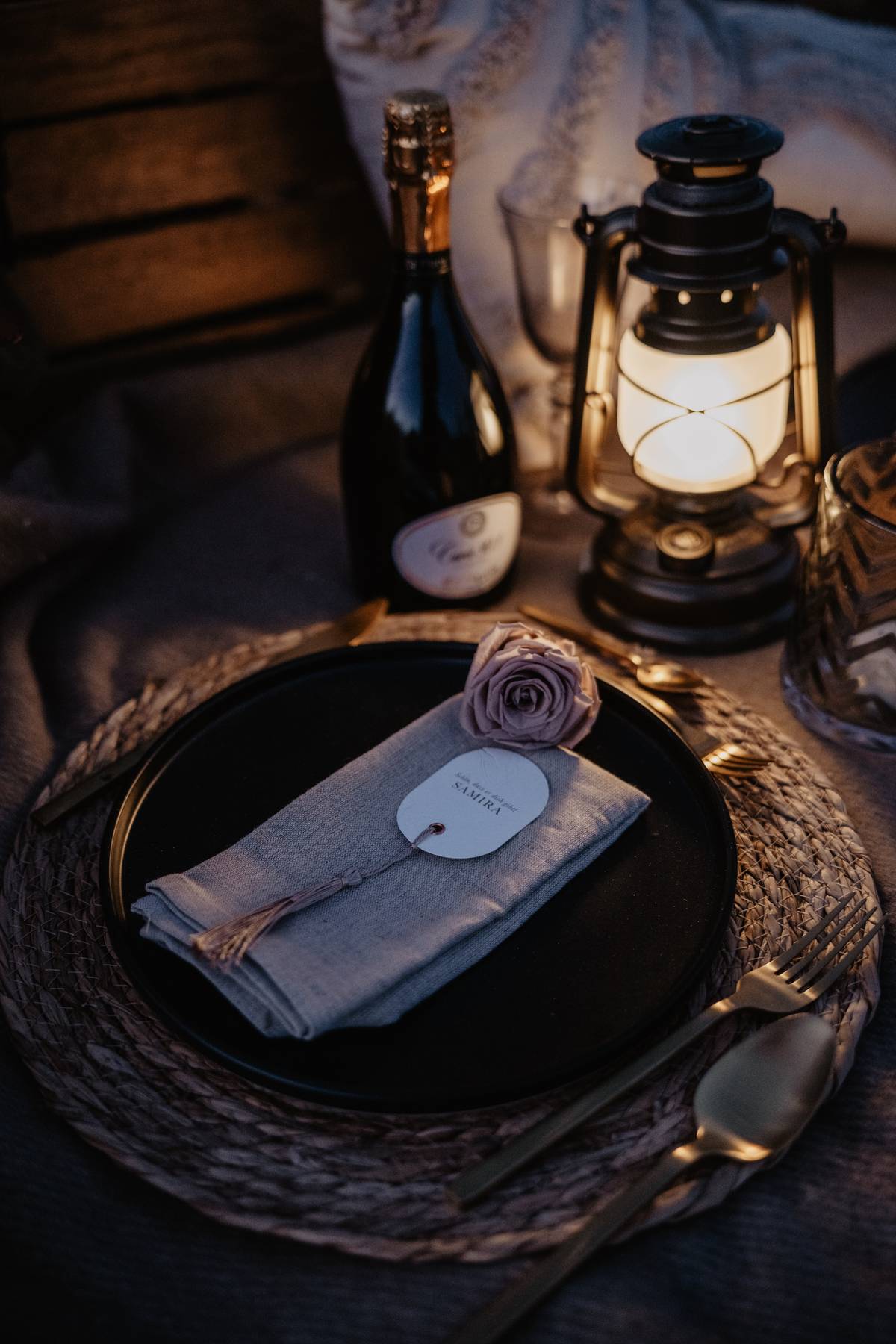 Luxury elopement dinner setup in the Dolomites — rustic table styling with champagne, florals, and alpine charm.