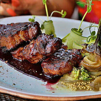 Spicy pork with wine sauce, baked eggplant – food delivery from DEPO Salsa Grill Restaurant